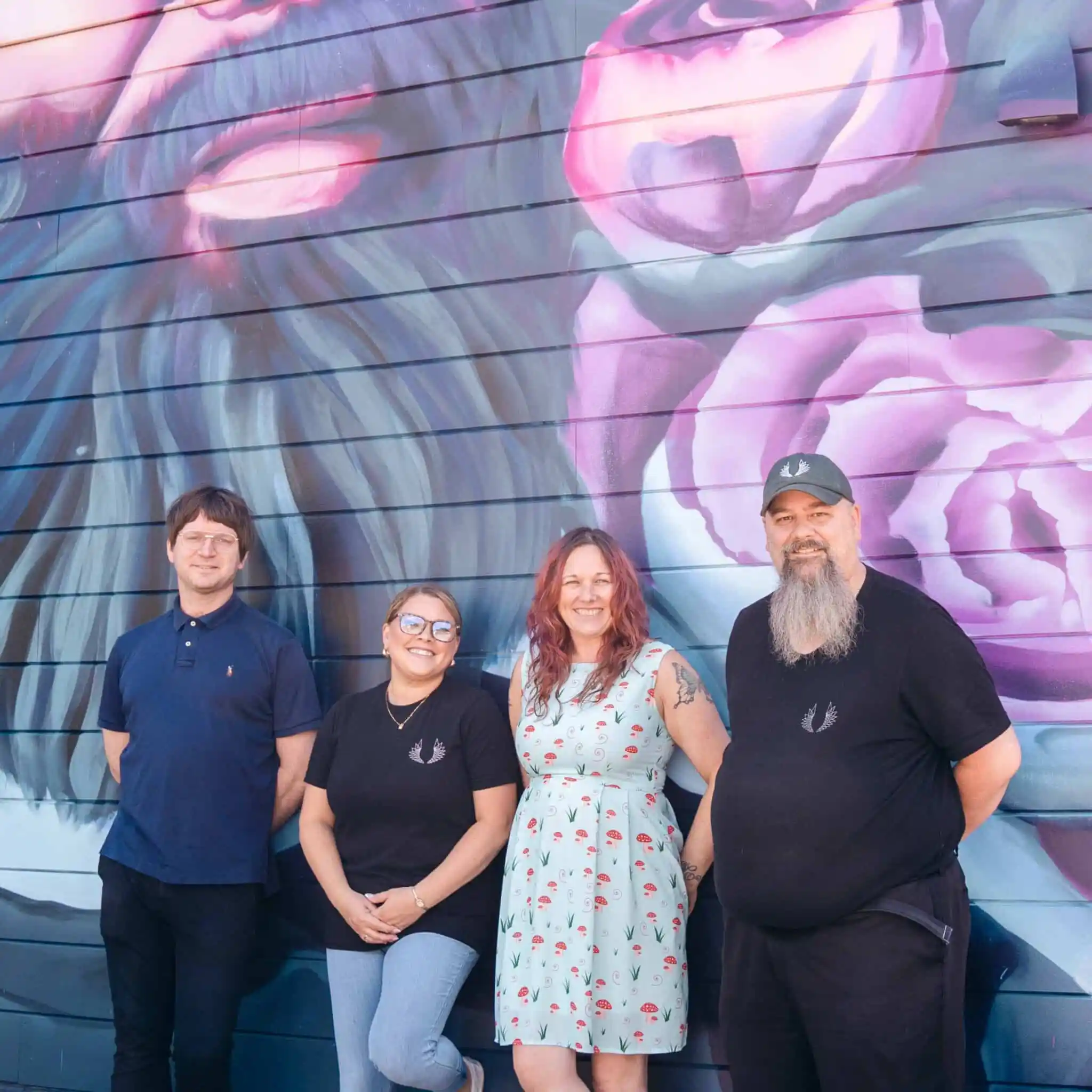 DSC06230 Liberty Cannabis team members in front of a multicolor background wall