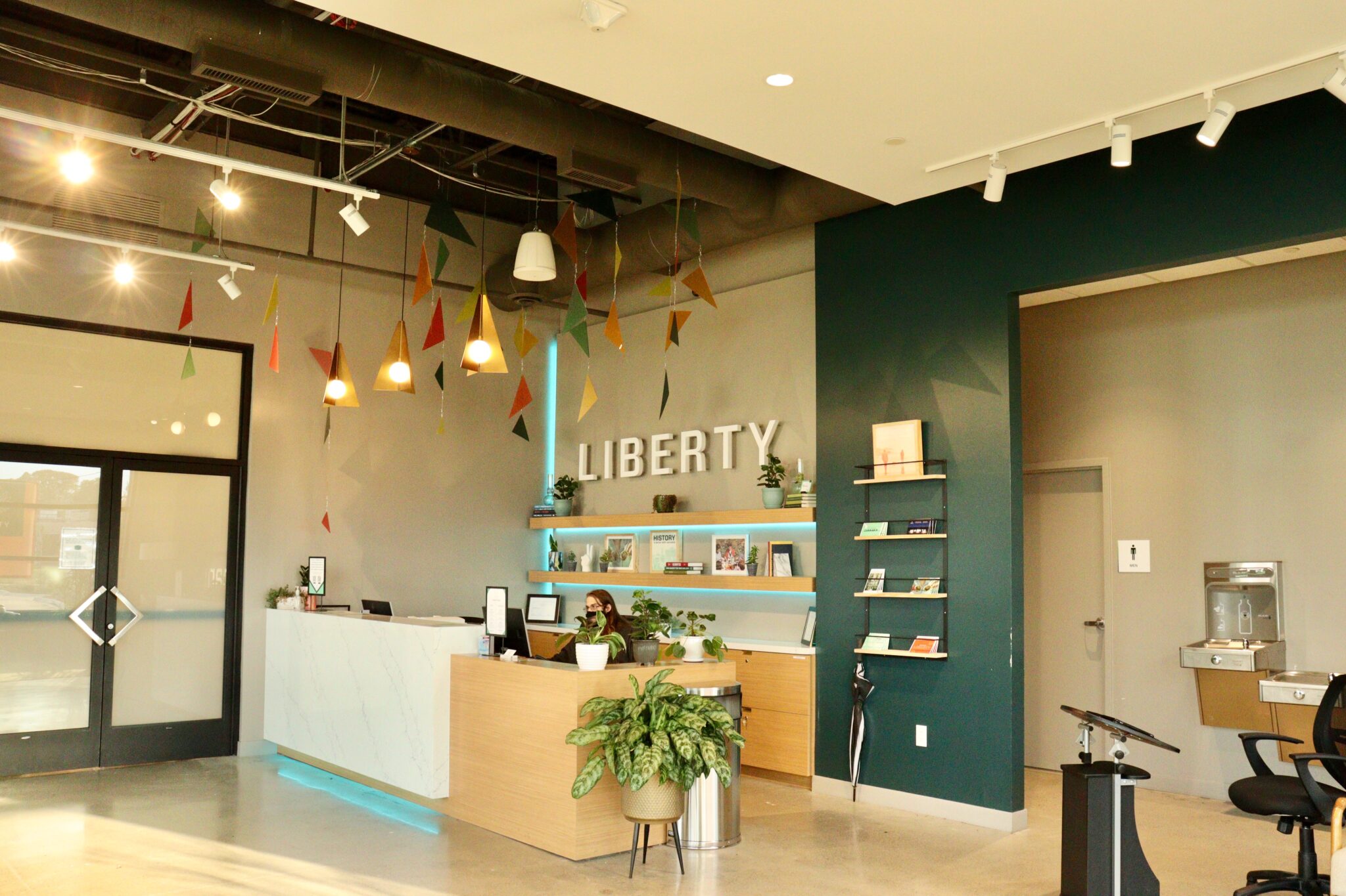 20211008053823_IMG_4250 Liberty Madison Heights dispensary interior with employee at check-in desk