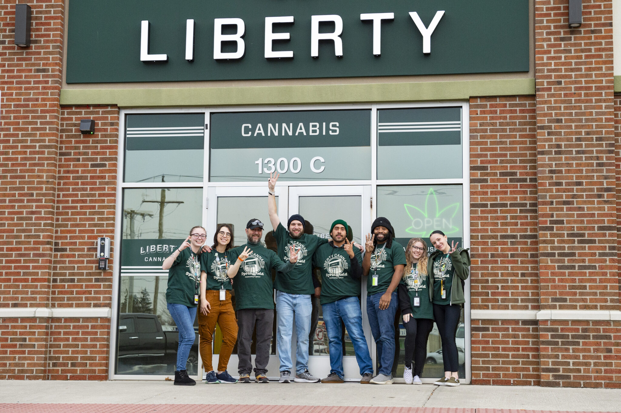 Liberty_Springfield_3yrs-2845_FINAL Liberty Dispensary Springfield team outside the storefront